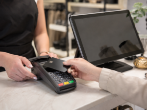 Restaurant owner checking sales before applying for business finance