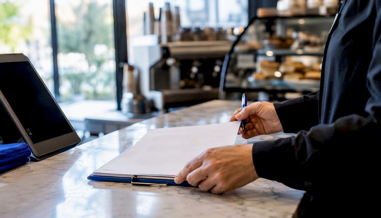 Hands adjusting hospitality shift roster